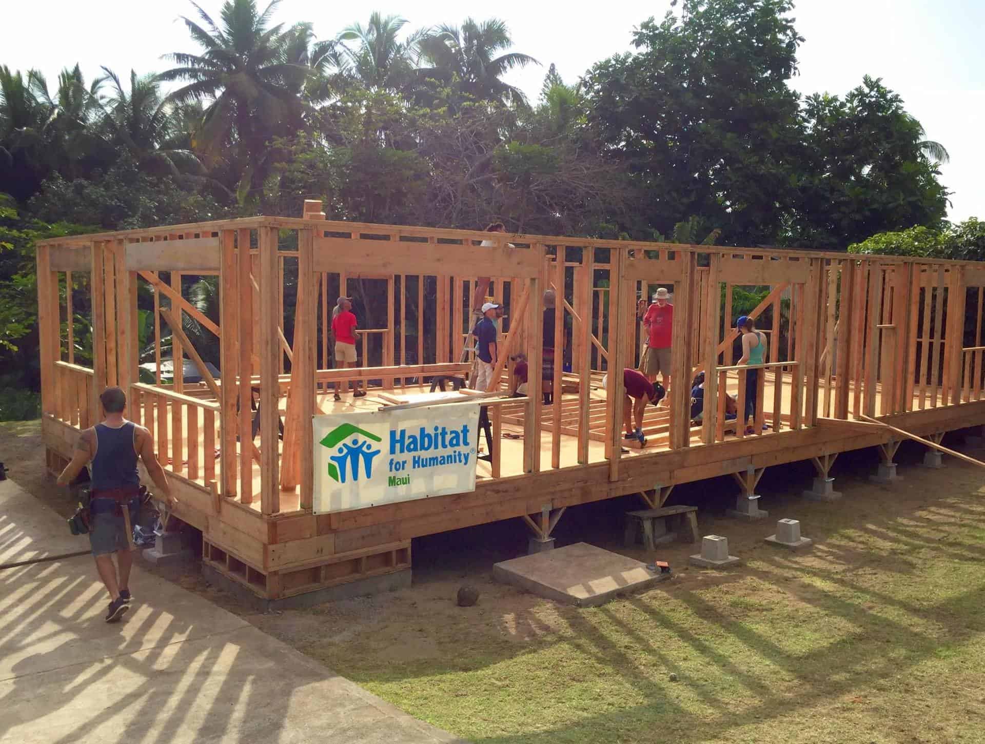 Habitat Maui volunteers building a wood-framed home